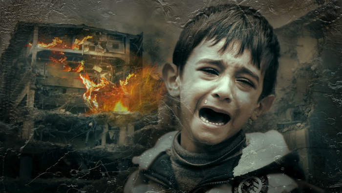 war scene of child crying in front of a burning building